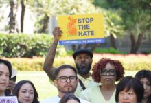 Lorreen Pryor, president and chief executive officer of the Black Youth Leadership Project (BYLP), stands among supporters of the Stop the Hate program at the State Capitol. Holding the sign is Fxxi Irvin, mentor and counselor for BYLP. CBM photo by Antonio Ray Harvey.