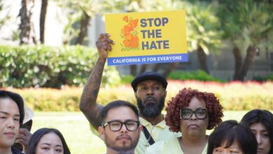 Lorreen Pryor, president and chief executive officer of the Black Youth Leadership Project (BYLP), stands among supporters of the Stop the Hate program at the State Capitol. Holding the sign is Fxxi Irvin, mentor and counselor for BYLP. CBM photo by Antonio Ray Harvey.